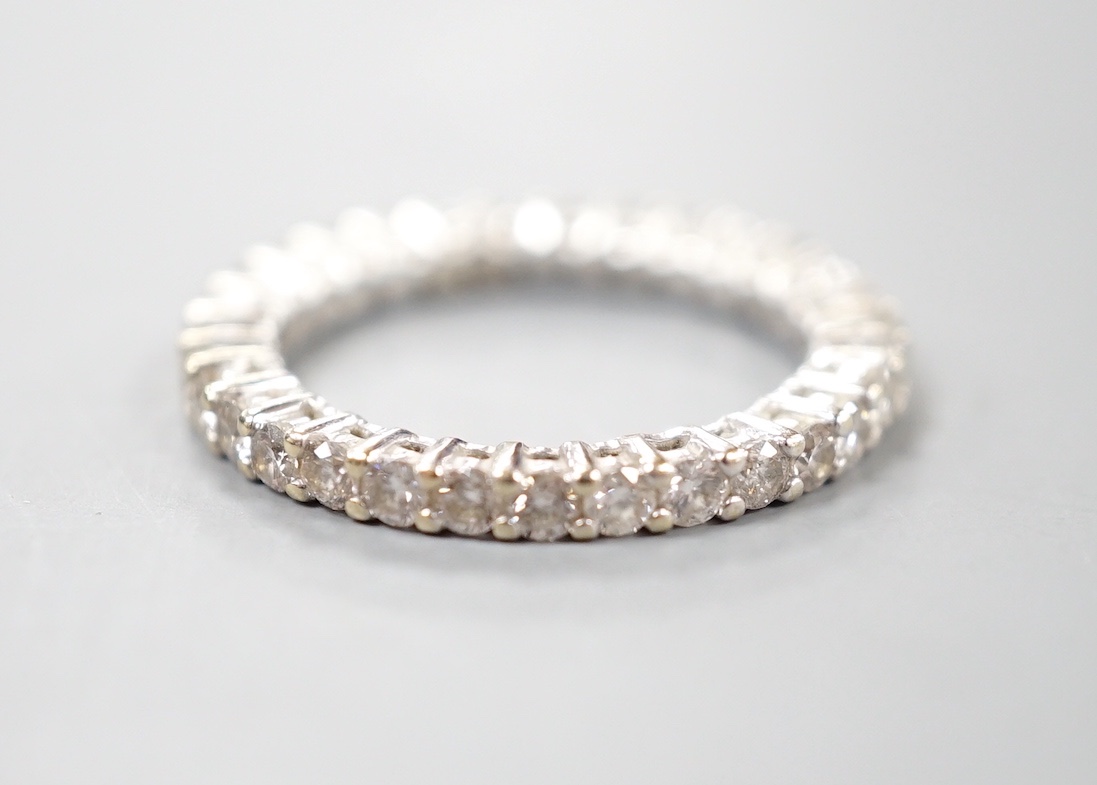 A modern 18ct white gold and diamond set full eternity ring, size M, gross weight 3.4 grams.